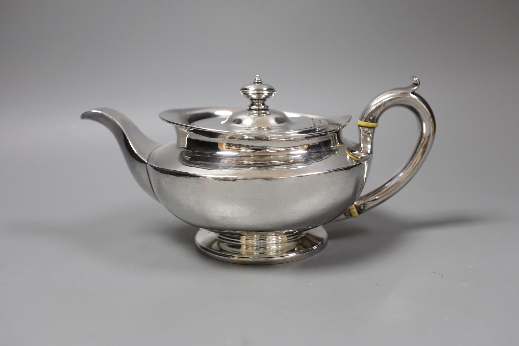 A George III squat circular silver teapot, by William Burwash, London 1820, gross 22oz.